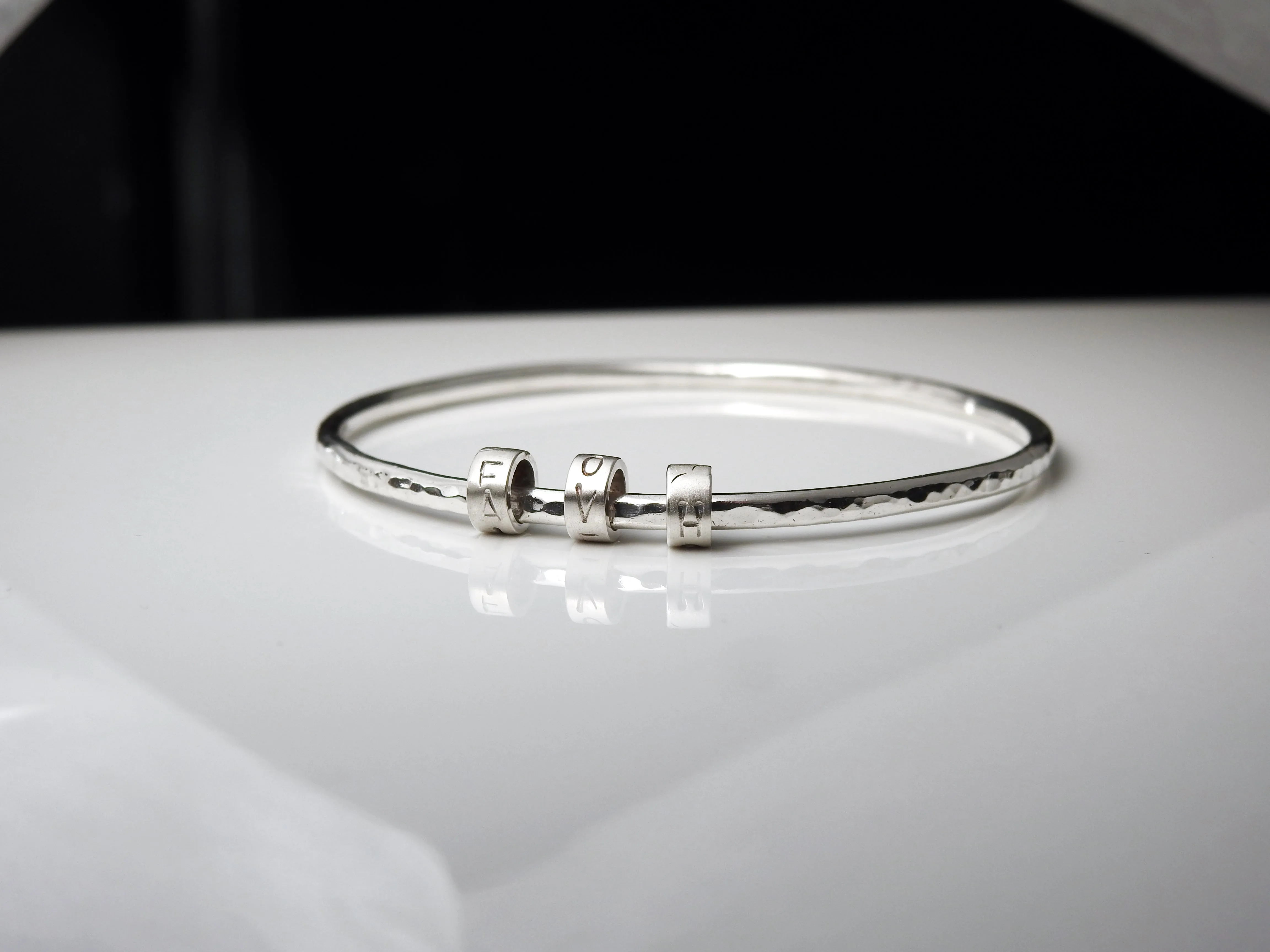 Rhythmic "LOVE" bangle